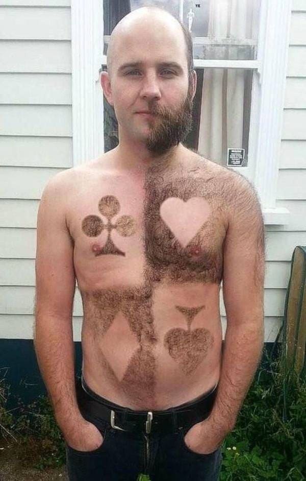 man shaved with playing card symbols on chest and stomach funny picture