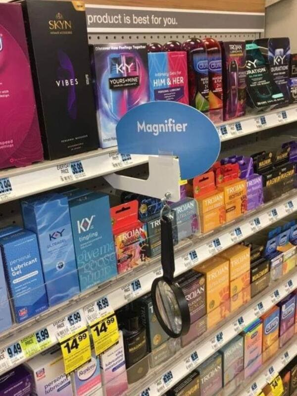 magnifier near condom rack funny picture